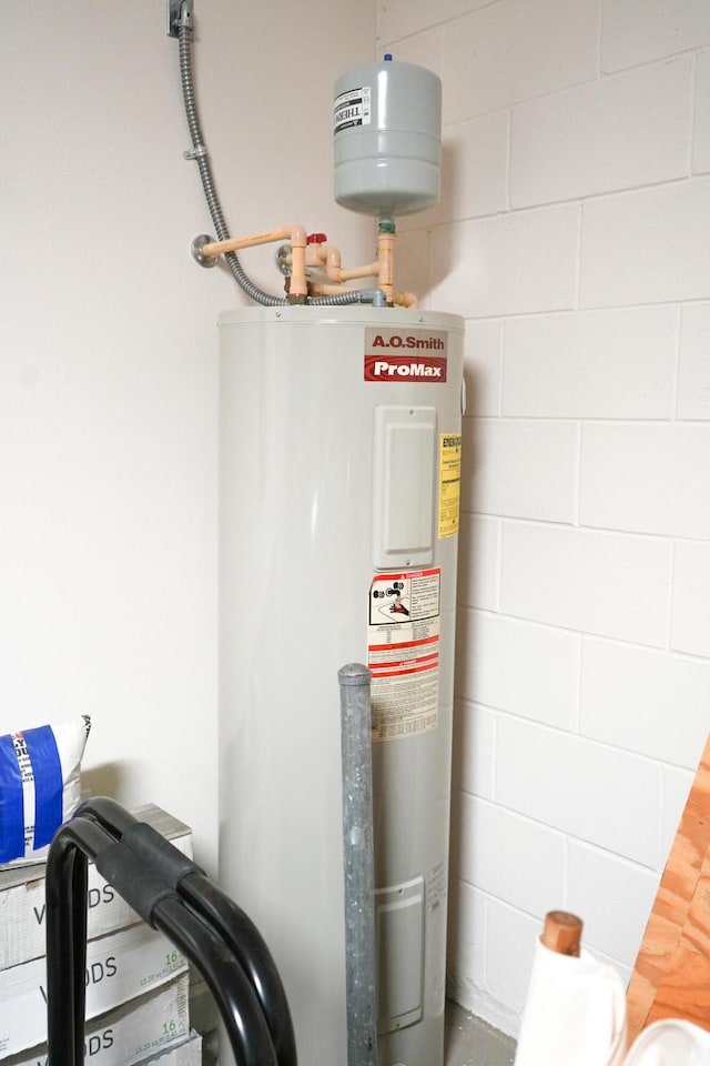 utility room featuring electric water heater