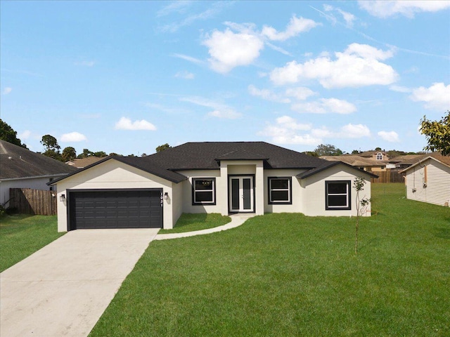 view of front of property with a front lawn and a garage