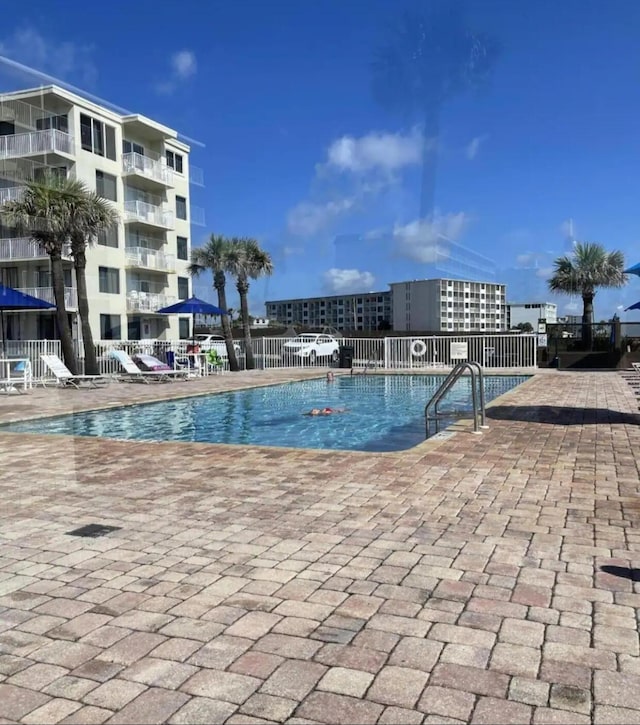 view of pool featuring a patio area