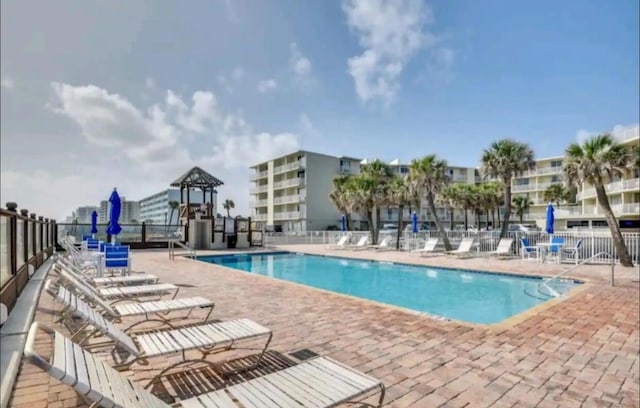 view of swimming pool with a patio area