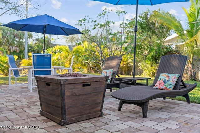 202 Monroe Ave, Cape Canaveral, FL 32920 - view of patio / terrace with an outdoor fire pit