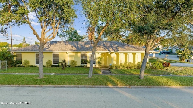 202 Monroe Ave, Cape Canaveral, FL 32920 - ranch-style house with a front lawn
