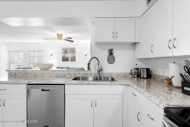 202 Monroe Ave, Cape Canaveral, FL 32920 - kitchen with appliances with stainless steel finishes, sink, white cabinets, and a textured ceiling
