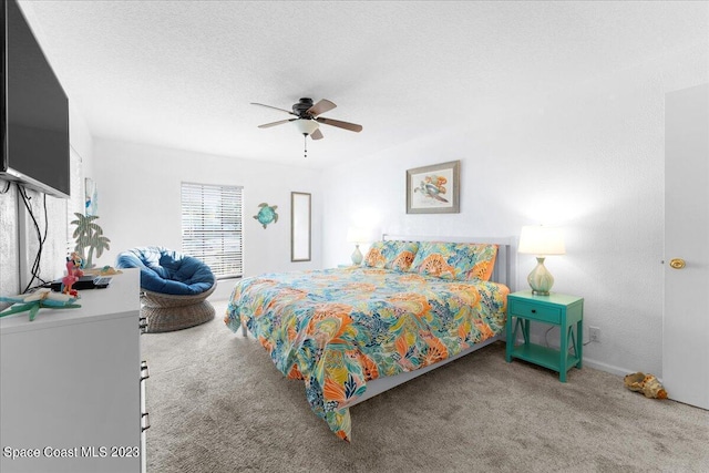 202 Monroe Ave, Cape Canaveral, FL 32920 - bedroom featuring a textured ceiling, ceiling fan, and carpet