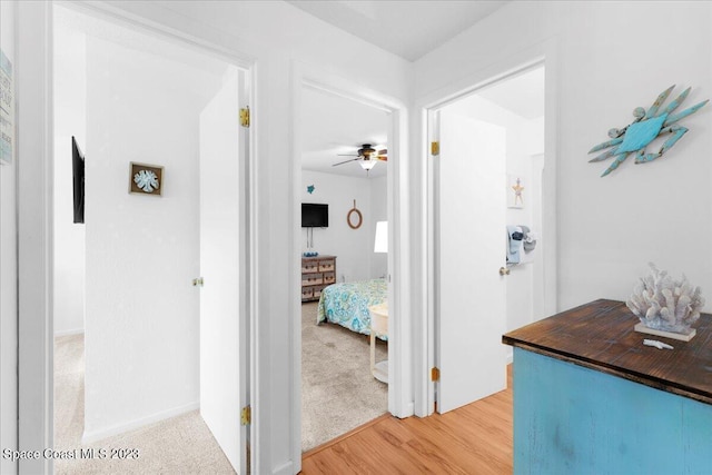 202 Monroe Ave, Cape Canaveral, FL 32920 - corridor featuring hardwood / wood-style flooring