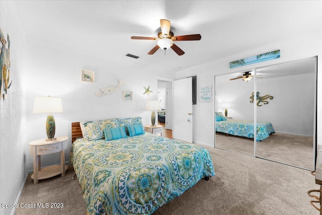 202 Monroe Ave, Cape Canaveral, FL 32920 - carpeted bedroom with a textured ceiling and ceiling fan