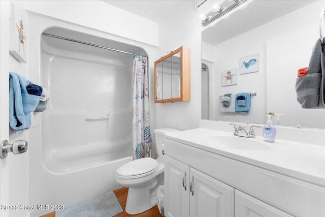 202 Monroe Ave, Cape Canaveral, FL 32920 - full bathroom with vanity, hardwood / wood-style flooring, toilet, and shower / bath combo with shower curtain
