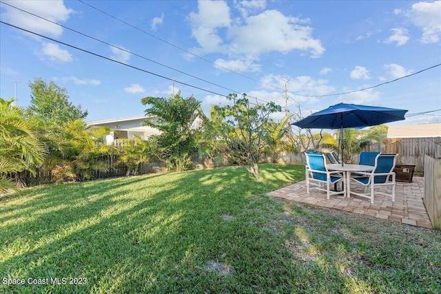 202 Monroe Ave, Cape Canaveral, FL 32920 - view of yard with a patio