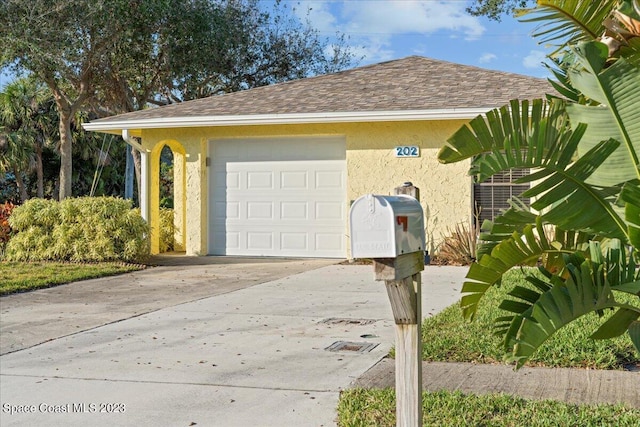 202 Monroe Ave, Cape Canaveral, FL 32920 - exterior space featuring a garage and an outbuilding