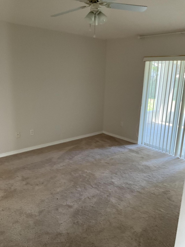 empty room with carpet and ceiling fan