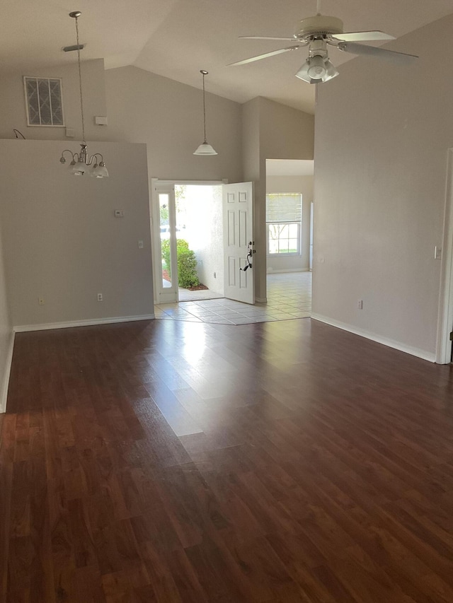 unfurnished room featuring dark hardwood / wood-style floors, ceiling fan, and high vaulted ceiling