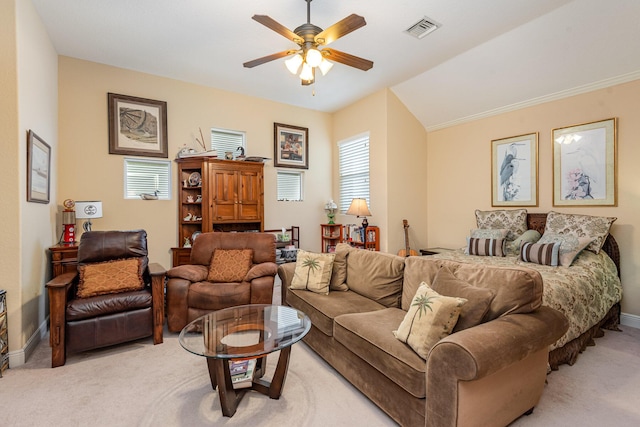 carpeted living room with vaulted ceiling and ceiling fan