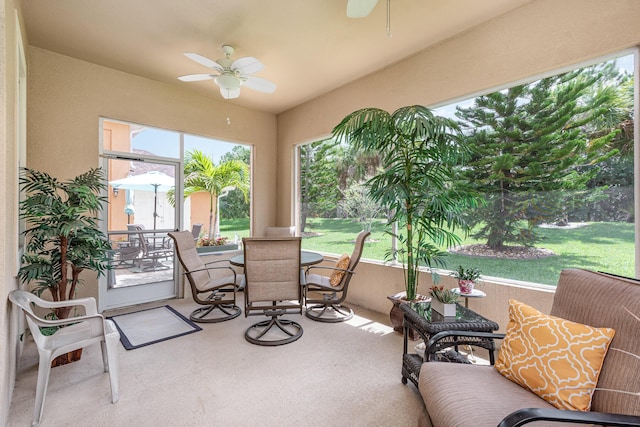 sunroom / solarium featuring ceiling fan