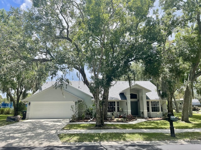 view of front of home featuring a garage and a front yard