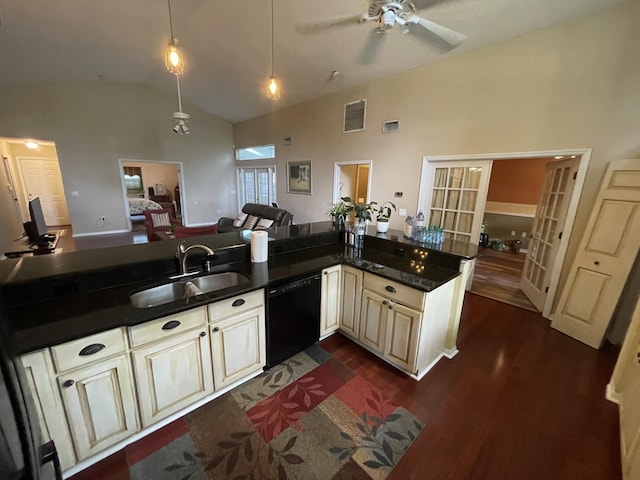 kitchen with sink, black dishwasher, kitchen peninsula, pendant lighting, and vaulted ceiling