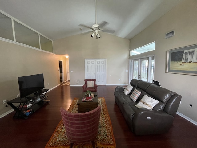 living room with dark hardwood / wood-style floors, ceiling fan, high vaulted ceiling, and french doors