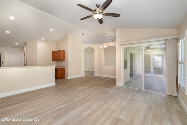 unfurnished living room with lofted ceiling, ceiling fan, and light hardwood / wood-style flooring