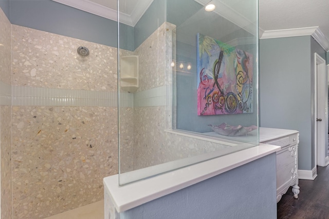 bathroom with walk in shower, vanity, hardwood / wood-style flooring, and crown molding