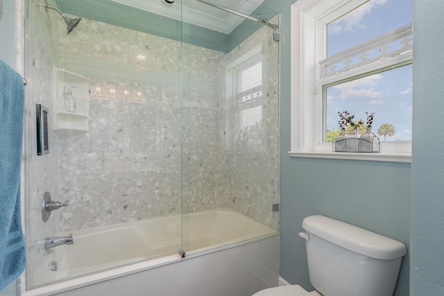 bathroom featuring enclosed tub / shower combo, crown molding, and toilet