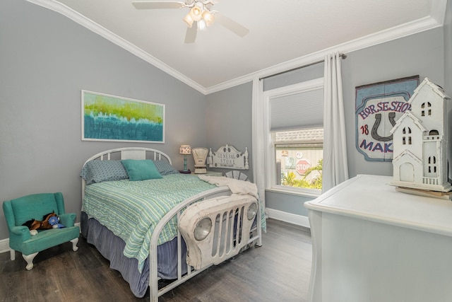 bedroom featuring vaulted ceiling, ceiling fan, dark hardwood / wood-style floors, and crown molding