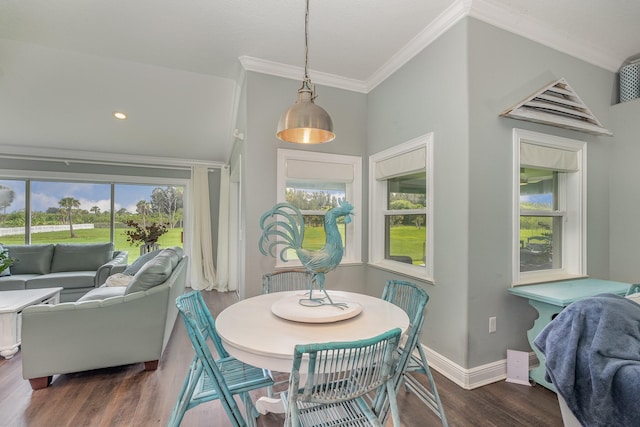 dining space with dark wood-type flooring and crown molding