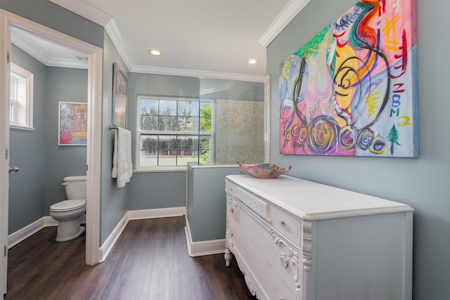 bathroom featuring hardwood / wood-style floors, ornamental molding, toilet, and vanity