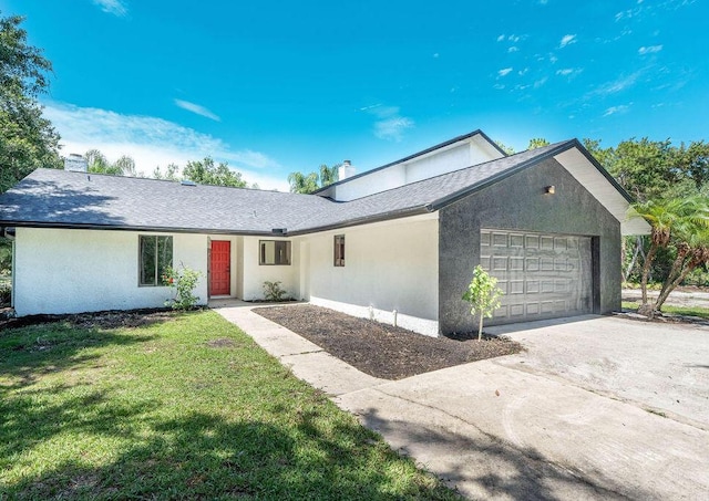 view of front facade featuring a front yard and a garage