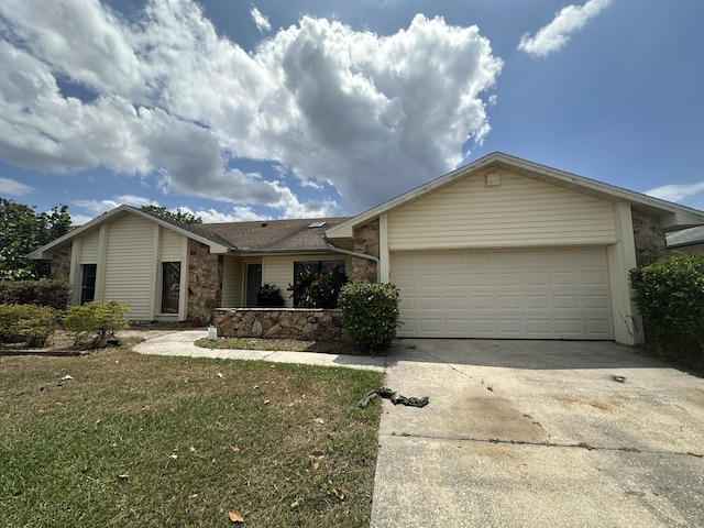 368 Fairgreen Pl, Casselberry, FL 32707 - single story home with stone siding, driveway, a front lawn, a garage, and a shingled roof
