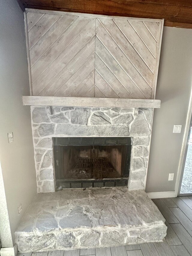 368 Fairgreen Pl, Casselberry, FL 32707 - details featuring baseboards, a fireplace, and wood finished floors