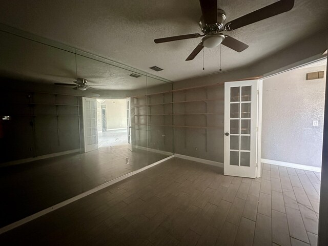 368 Fairgreen Pl, Casselberry, FL 32707 - unfurnished room with wood finished floors, a textured ceiling, baseboards, visible vents, and ceiling fan