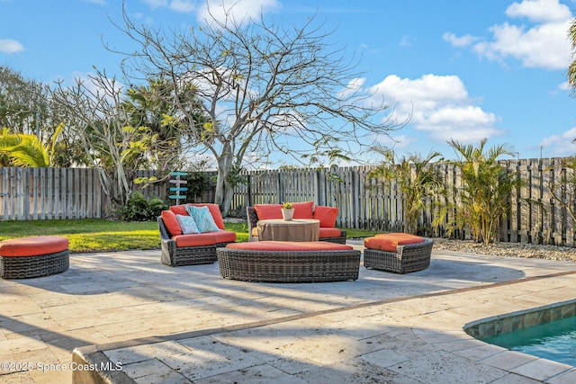 view of patio / terrace featuring a fenced backyard and an outdoor hangout area