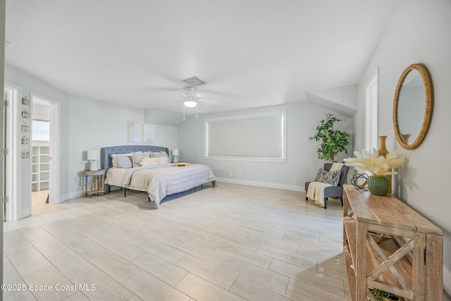 bedroom with visible vents, baseboards, light wood-style flooring, and a ceiling fan