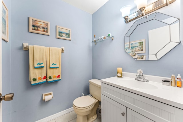 bathroom with tile patterned floors, vanity, and toilet