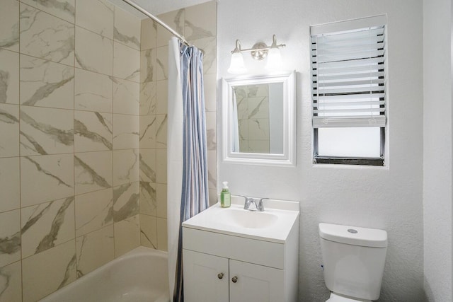 full bathroom with vanity, shower / bath combination with curtain, and toilet