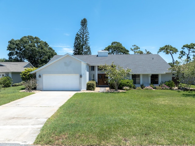 ranch-style house featuring a garage and a front lawn