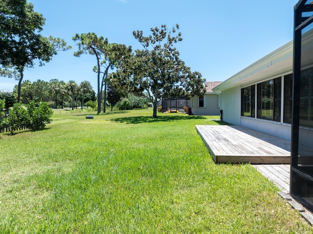 view of yard with a wooden deck