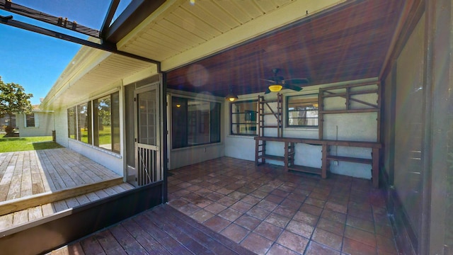 wooden deck featuring a ceiling fan