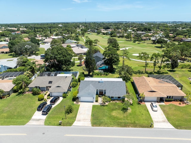 drone / aerial view featuring golf course view and a residential view