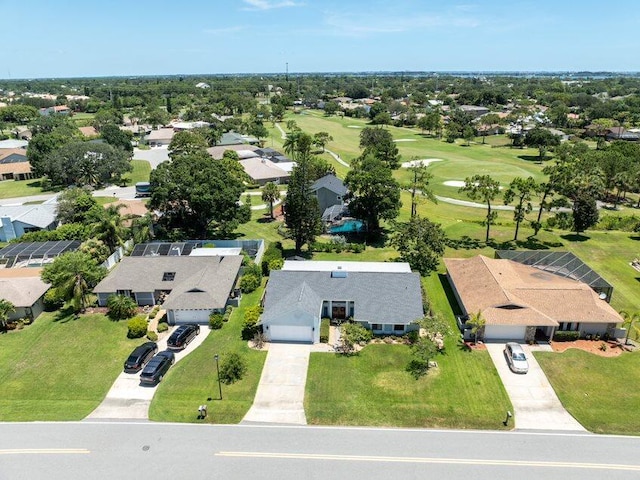 birds eye view of property with a residential view and golf course view