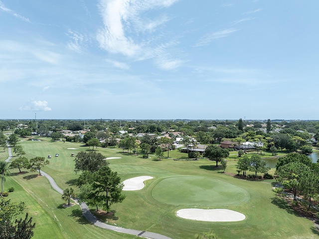 birds eye view of property with view of golf course