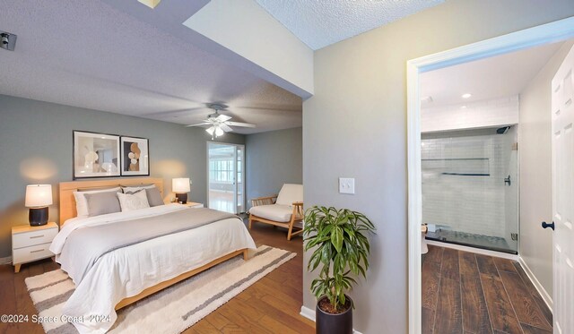 bedroom with ceiling fan, dark hardwood / wood-style flooring, and a textured ceiling