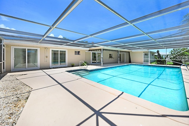 view of pool with a lanai and a patio