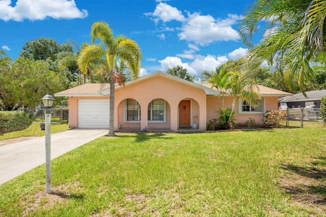 single story home featuring a garage and a front lawn