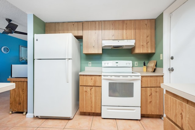 kitchen with white appliances and light tile patterned floors