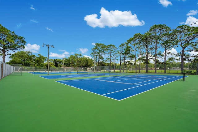 view of sport court with basketball hoop