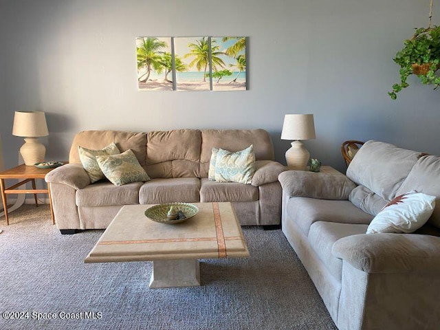 living room with dark carpet