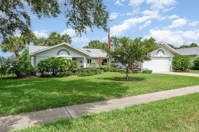 single story home with a garage and a front yard