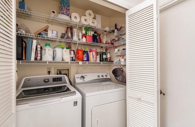 clothes washing area featuring independent washer and dryer