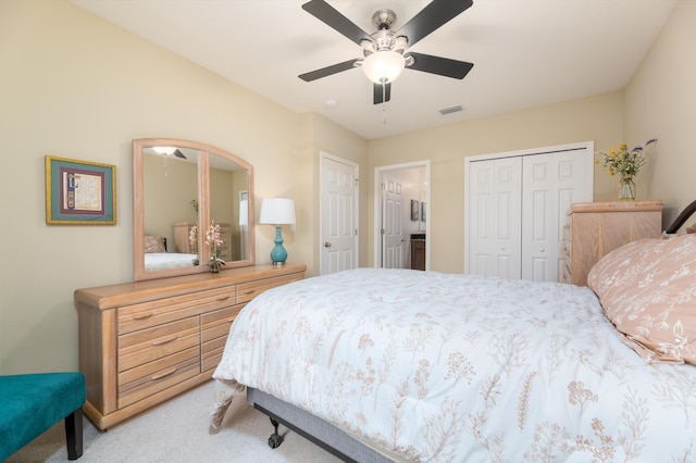 bedroom with ceiling fan and light colored carpet