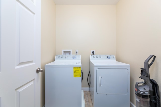 washroom with washing machine and dryer